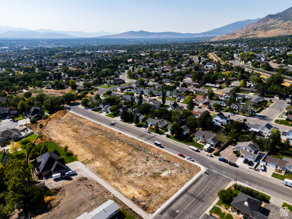 Birds eye view of property with a mountain view