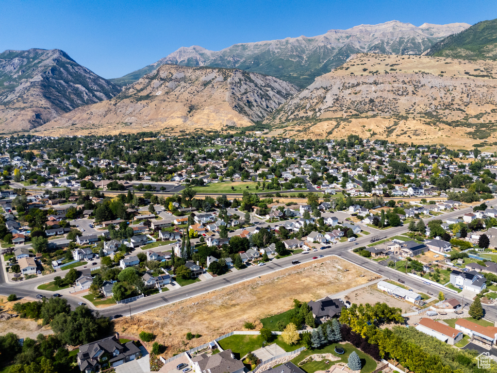 Birds eye view of property with a mountain view