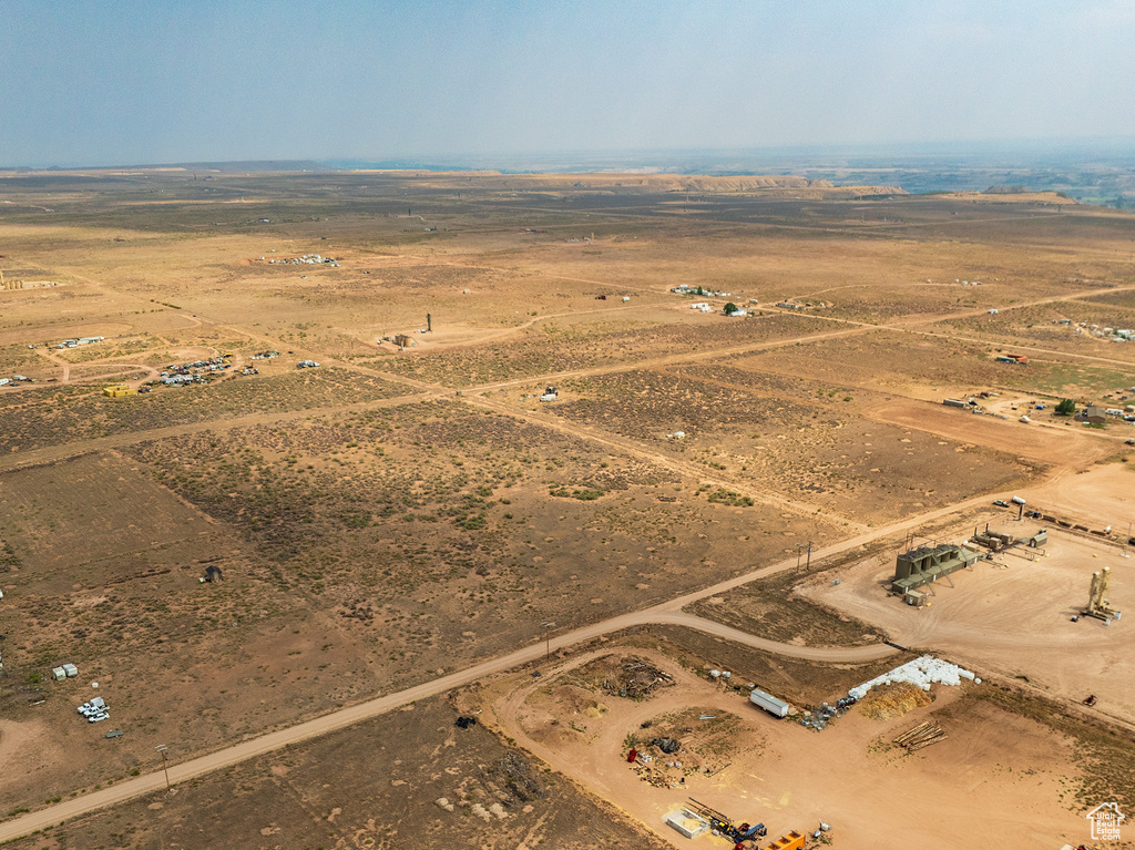 Birds eye view of property with a rural view