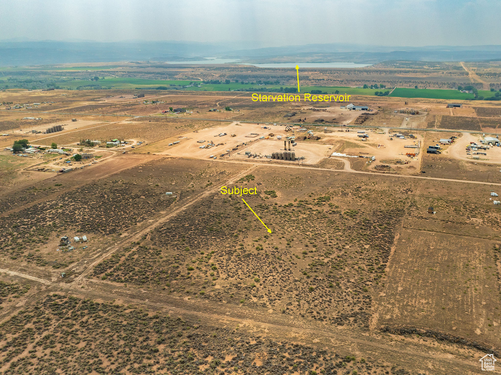 Birds eye view of property with a rural view