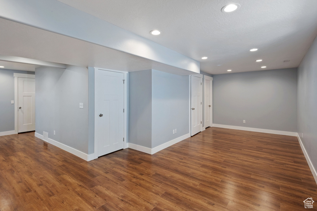 Basement with hardwood / wood-style flooring