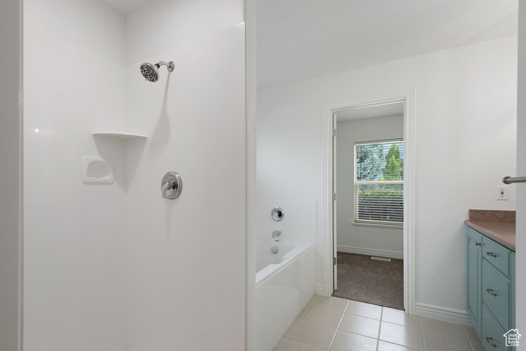 Bathroom featuring vanity and tile patterned floors