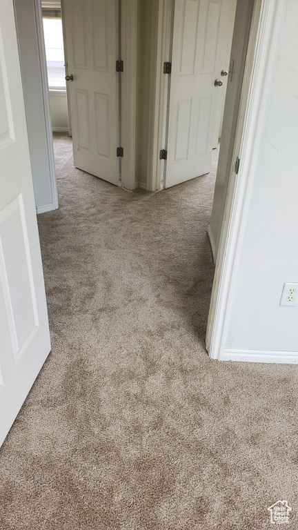 Corridor with carpet flooring