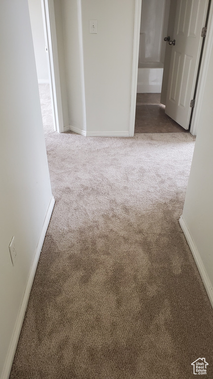 Empty room with baseboards and carpet flooring