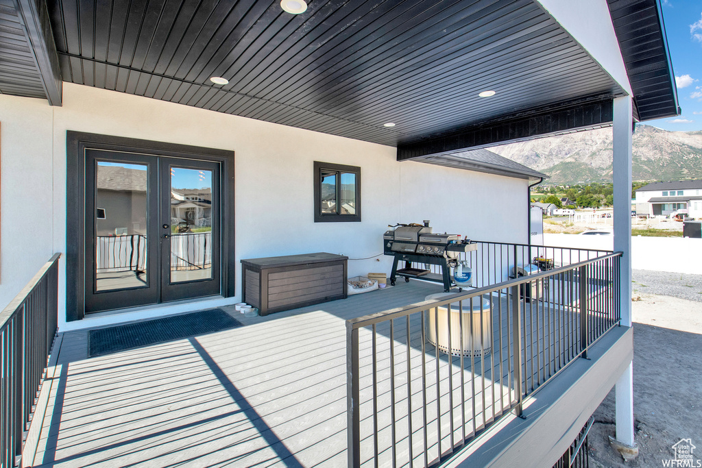 Deck featuring a mountain view and french doors