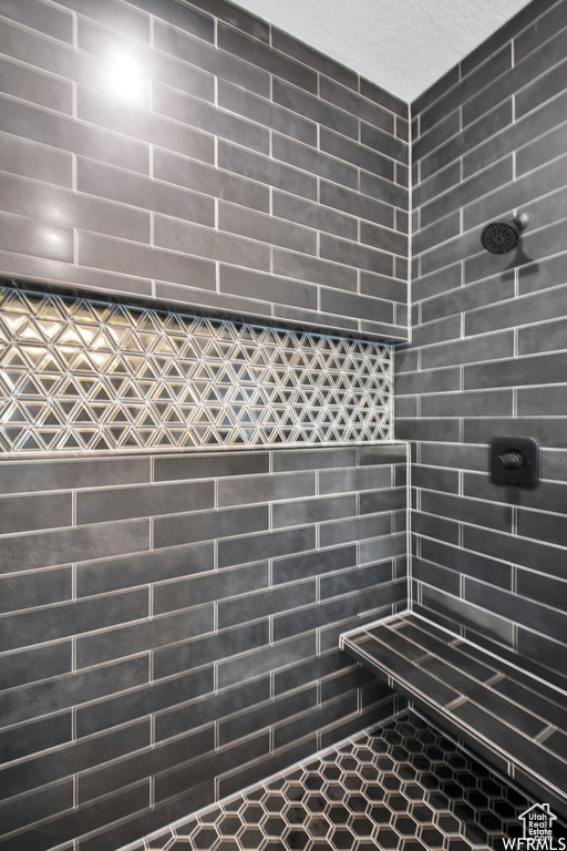 Bathroom featuring tiled shower