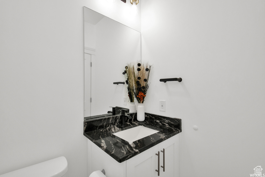 Bathroom with vanity and toilet