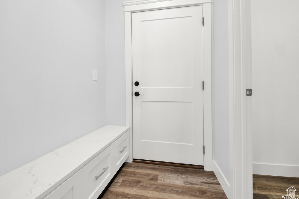 Mudroom with hardwood / wood-style flooring