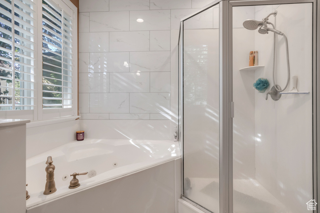 Bathroom featuring separate shower and tub