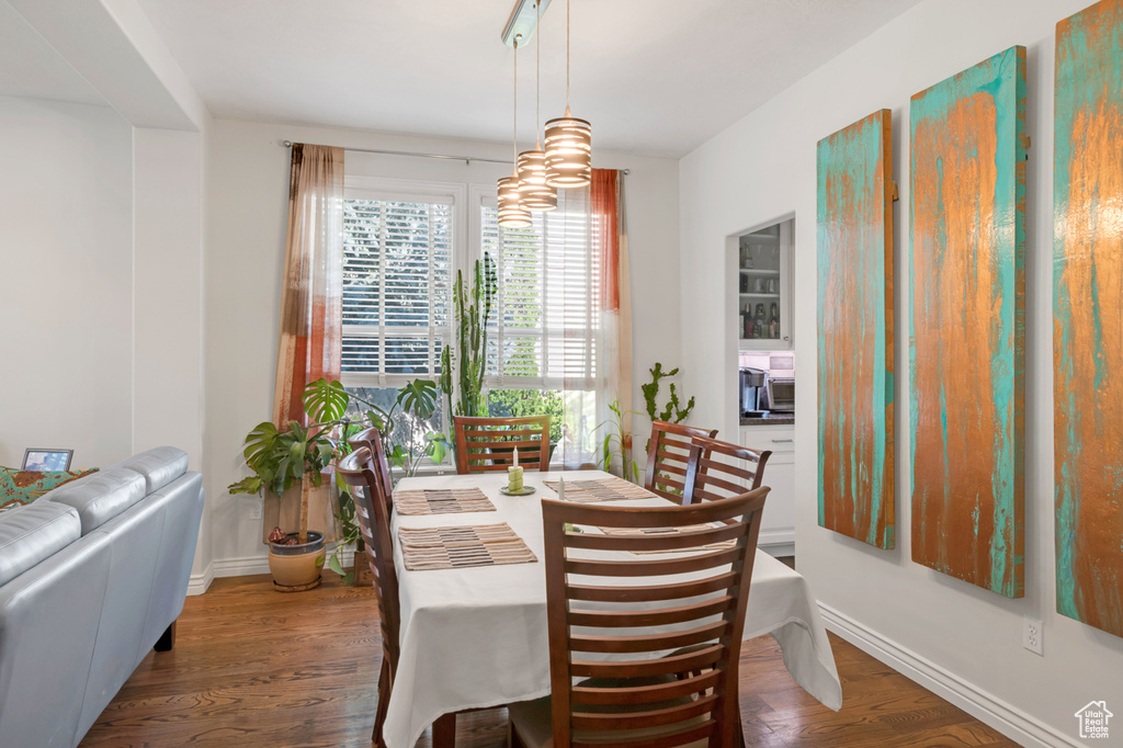 Dining space with wood-type flooring