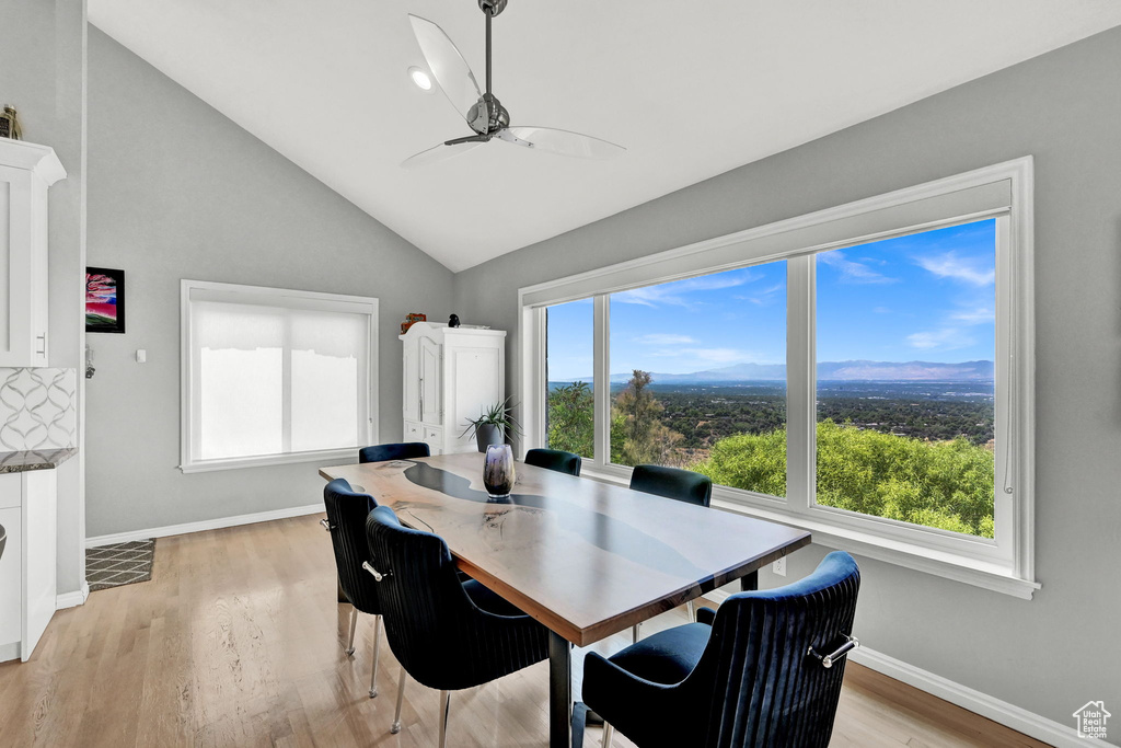 Dining space featuring light wood-type flooring, ceiling fan, and a healthy amount of sunlight