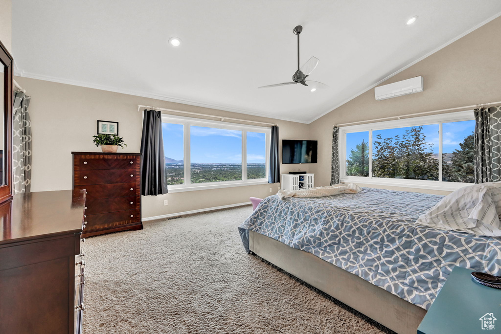 Bedroom with an AC wall unit, crown molding, carpet floors, ceiling fan, and vaulted ceiling