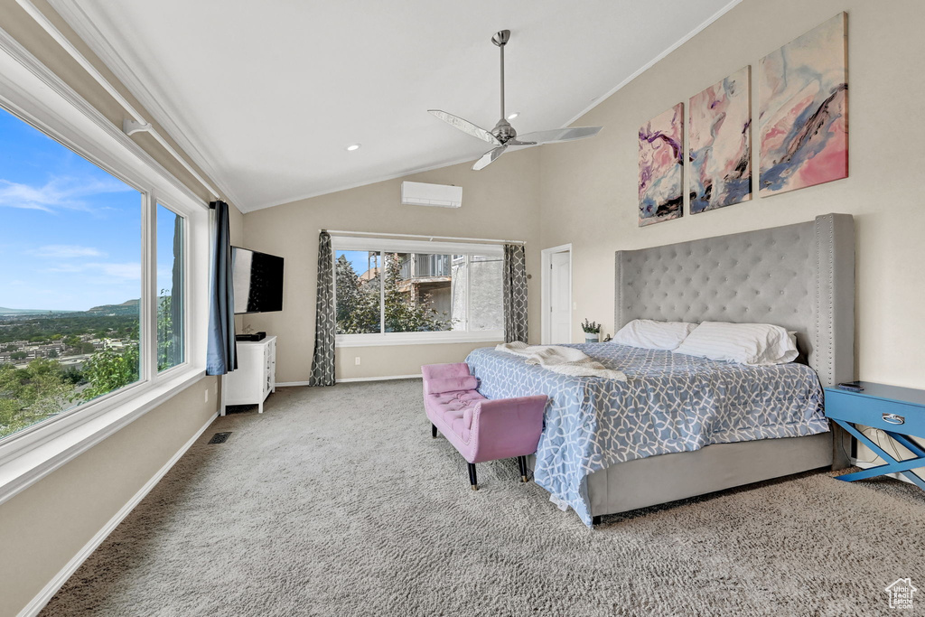 Bedroom with lofted ceiling, carpet flooring, crown molding, ceiling fan, and a wall mounted AC