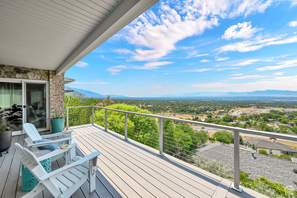 Wooden deck featuring a mountain view