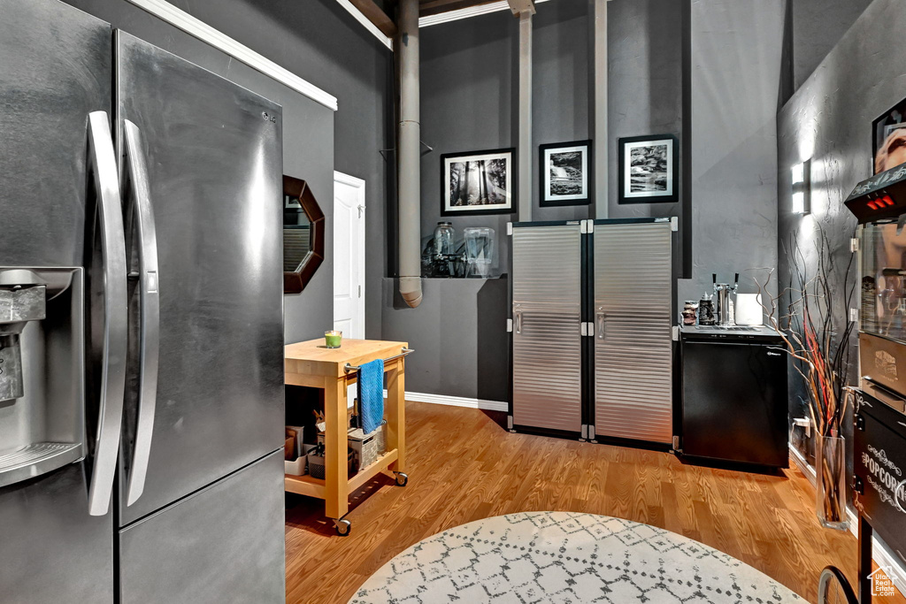 Kitchen with stainless steel fridge and light wood-type flooring