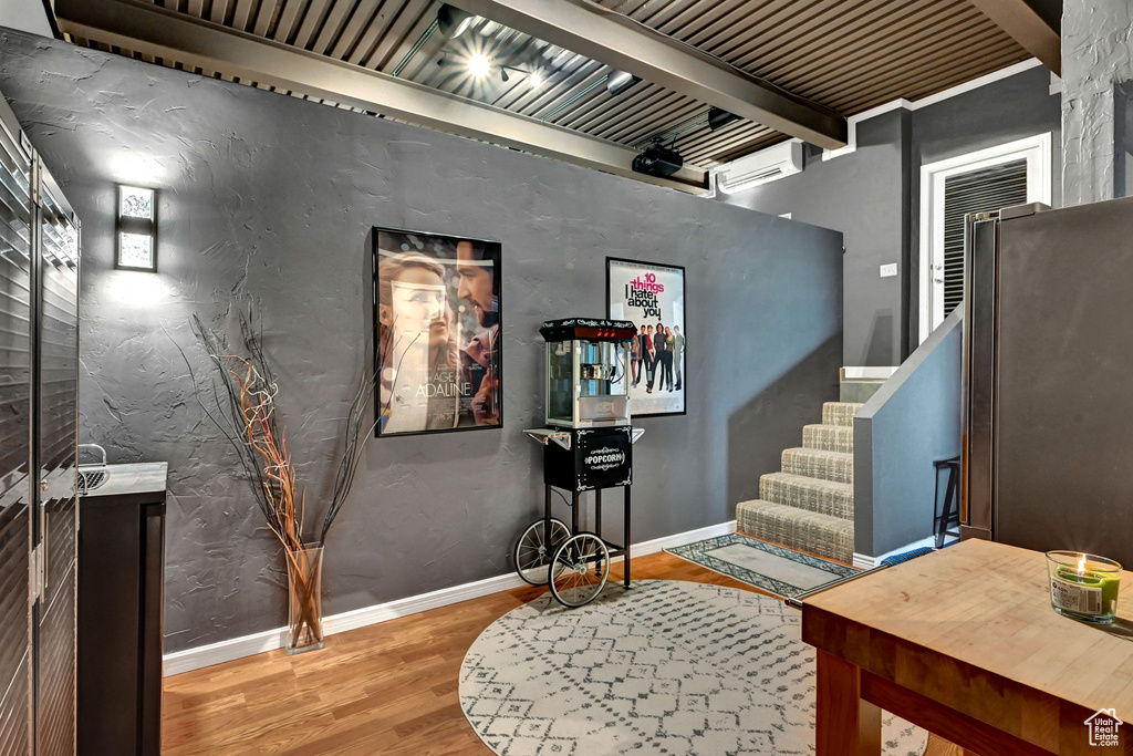 Interior space featuring beam ceiling and hardwood / wood-style flooring