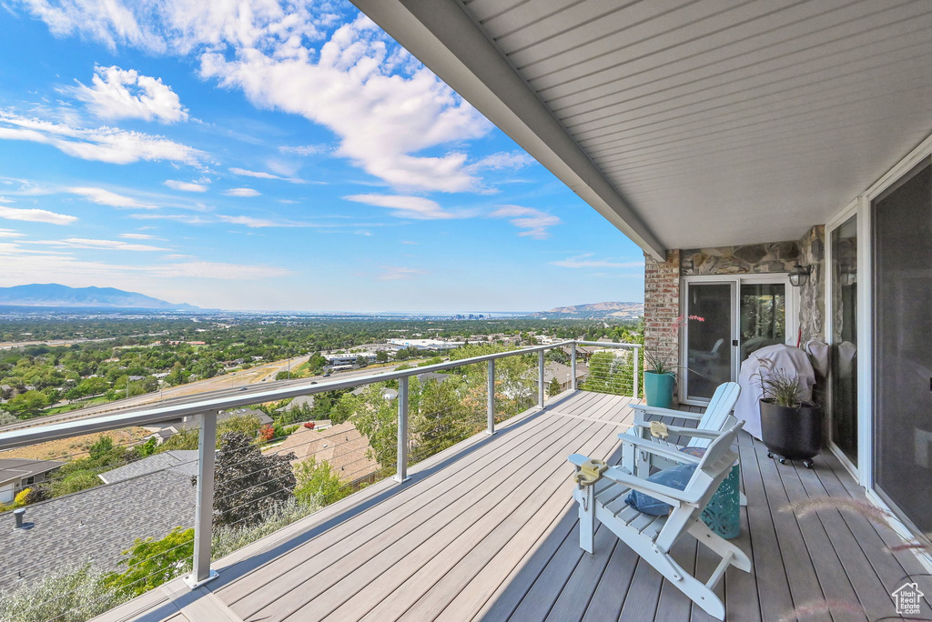 Wooden terrace featuring a mountain view