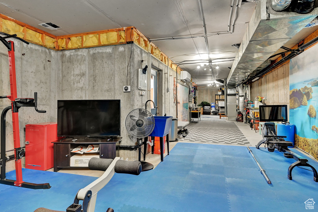 Basement featuring an AC wall unit