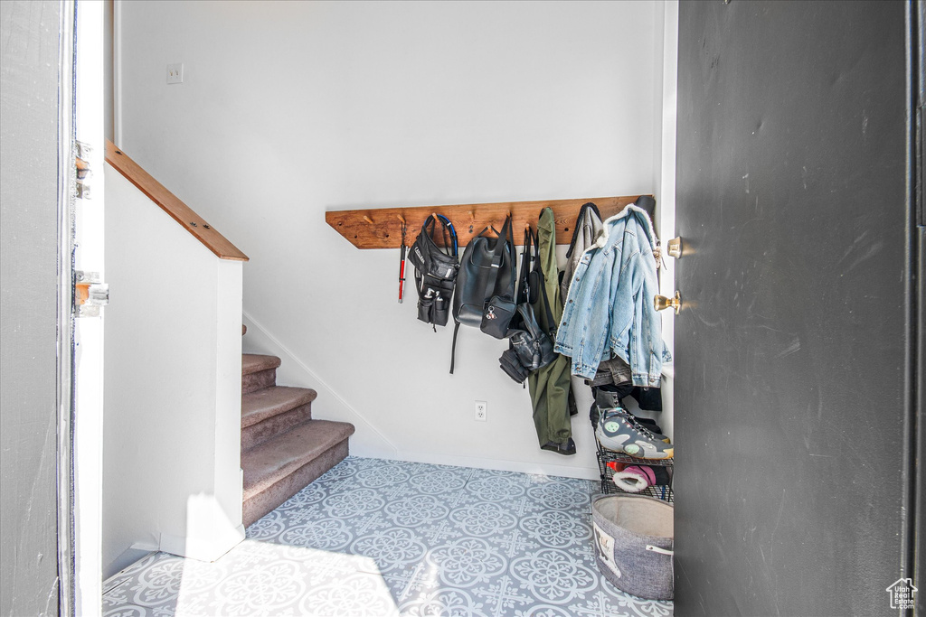 Walk in closet featuring light tile patterned floors