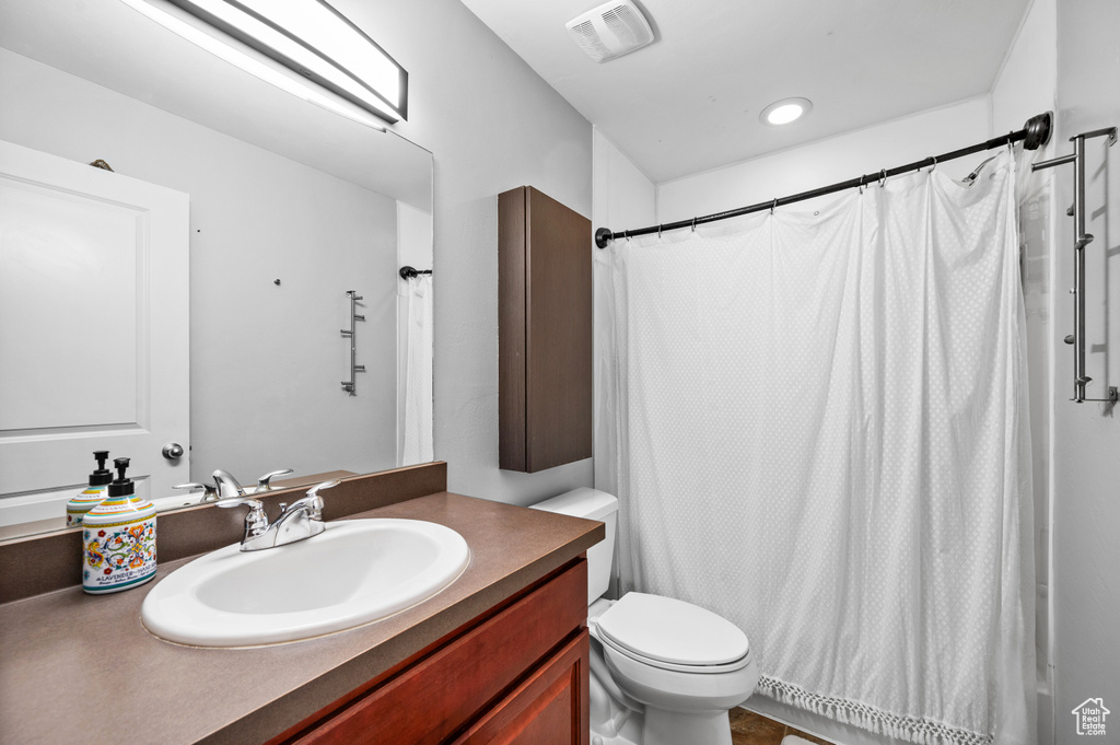 Bathroom with vanity and toilet