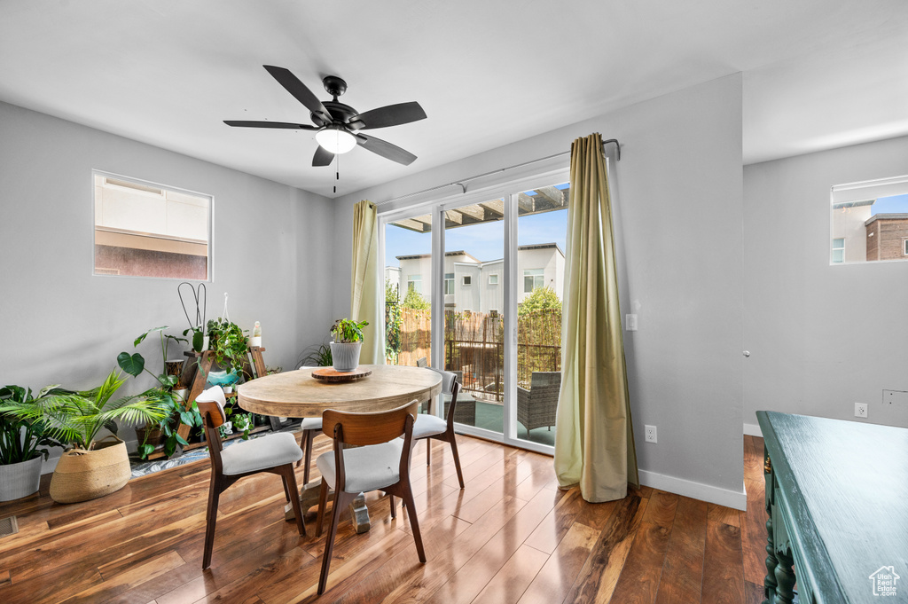 Dining room featuring hardwood / wood-style flooring and ceiling fan