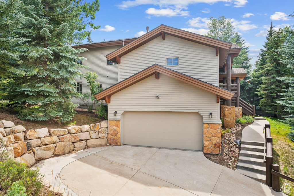 View of front of property featuring a garage