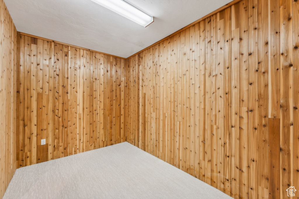 Empty room featuring wooden walls