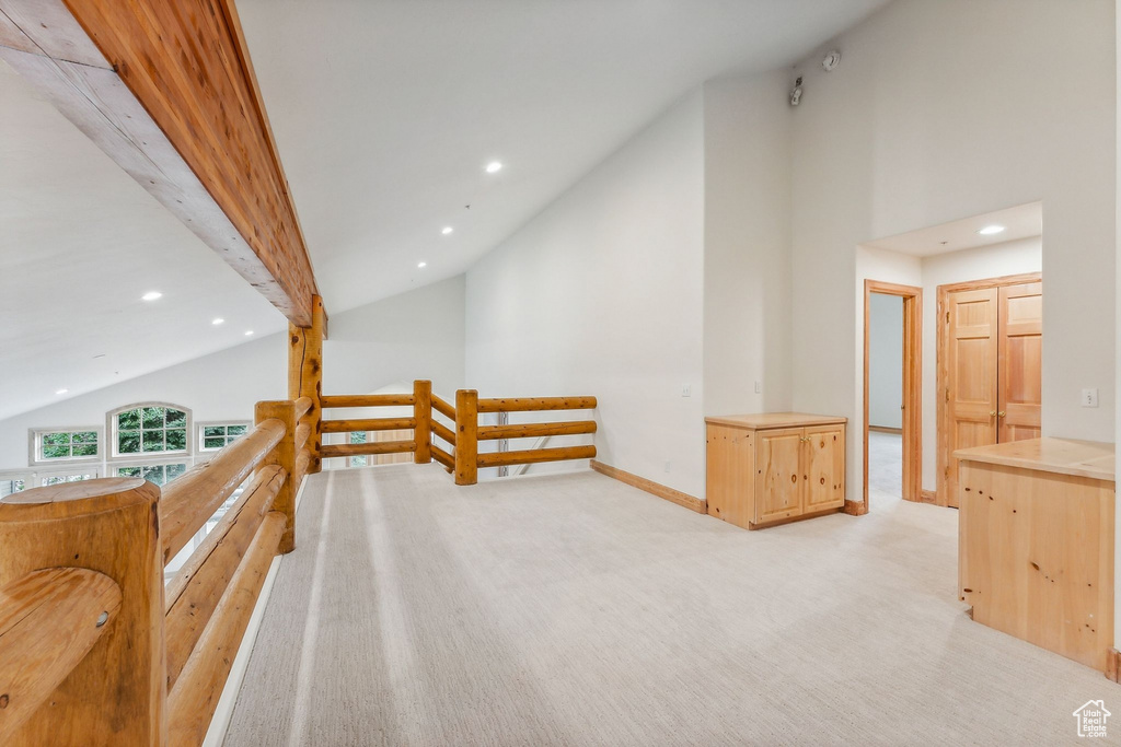 Interior space with vaulted ceiling with beams