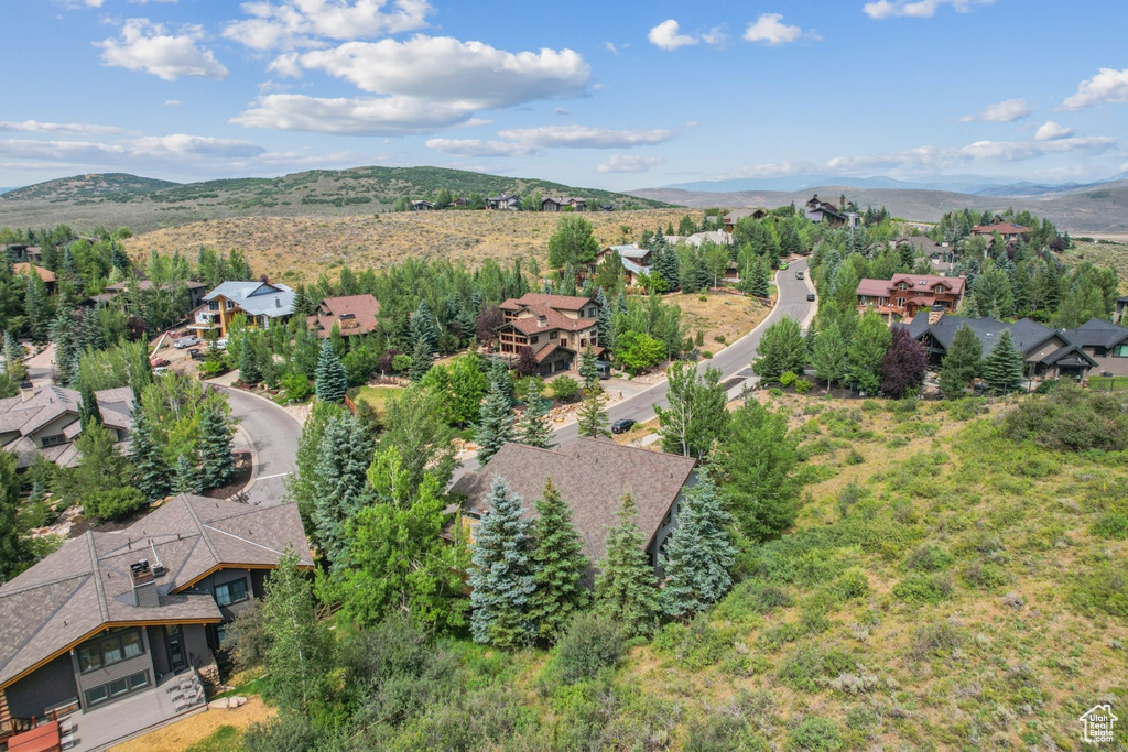 Birds eye view of property with a mountain view