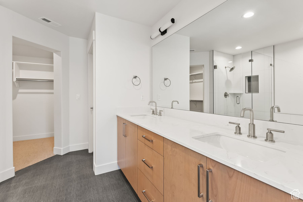 Bathroom with double sink vanity and walk in shower