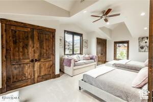 Bedroom featuring ceiling fan and vaulted ceiling