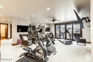 Workout room featuring ceiling fan