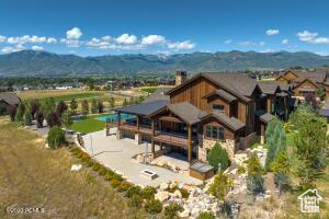 Rear view of property featuring a mountain view