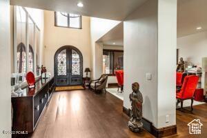 Foyer featuring dark wood-type flooring and french doors