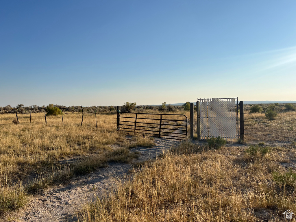 View of yard with a rural view