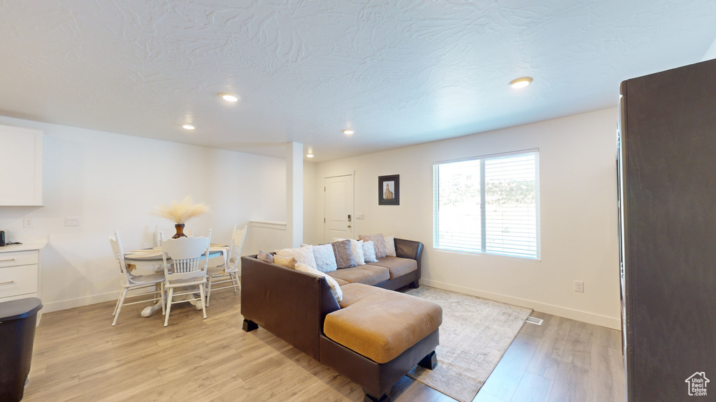 Living room with light wood-type flooring