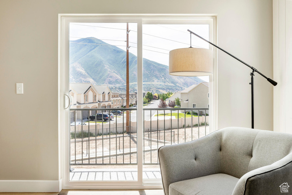 Sitting room featuring a mountain view and hardwood / wood-style floors