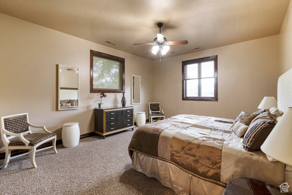 Bedroom featuring carpet and ceiling fan