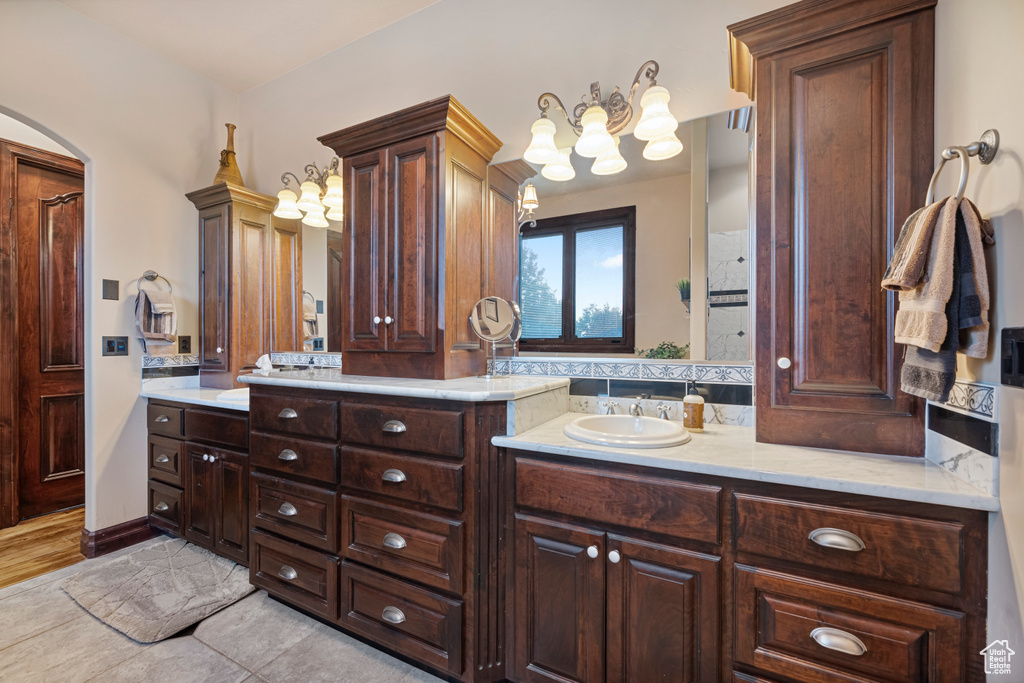 Bathroom featuring tile patterned flooring and vanity