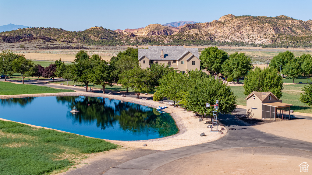 View of swimming pool featuring a water and mountain view