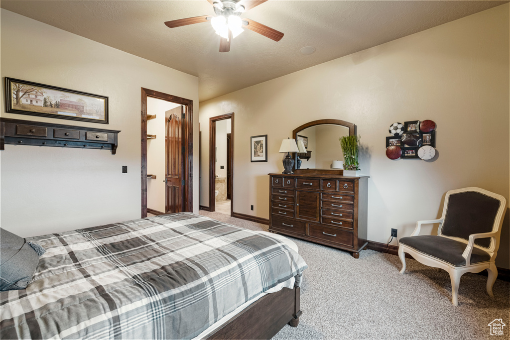 Bedroom featuring light carpet and ceiling fan