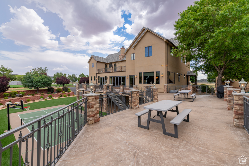 Rear view of property with a balcony