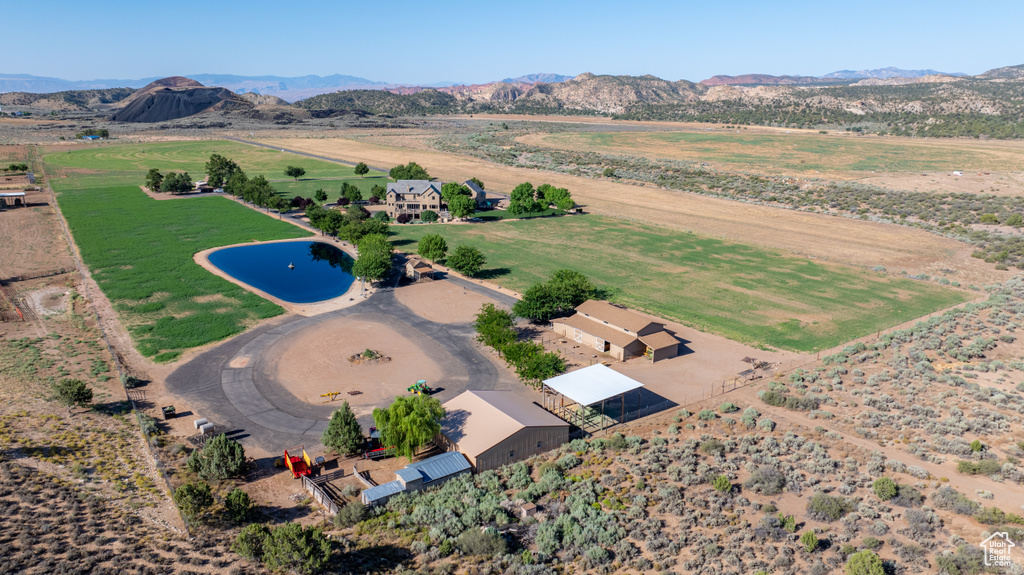 Birds eye view of property featuring a mountain view and a rural view