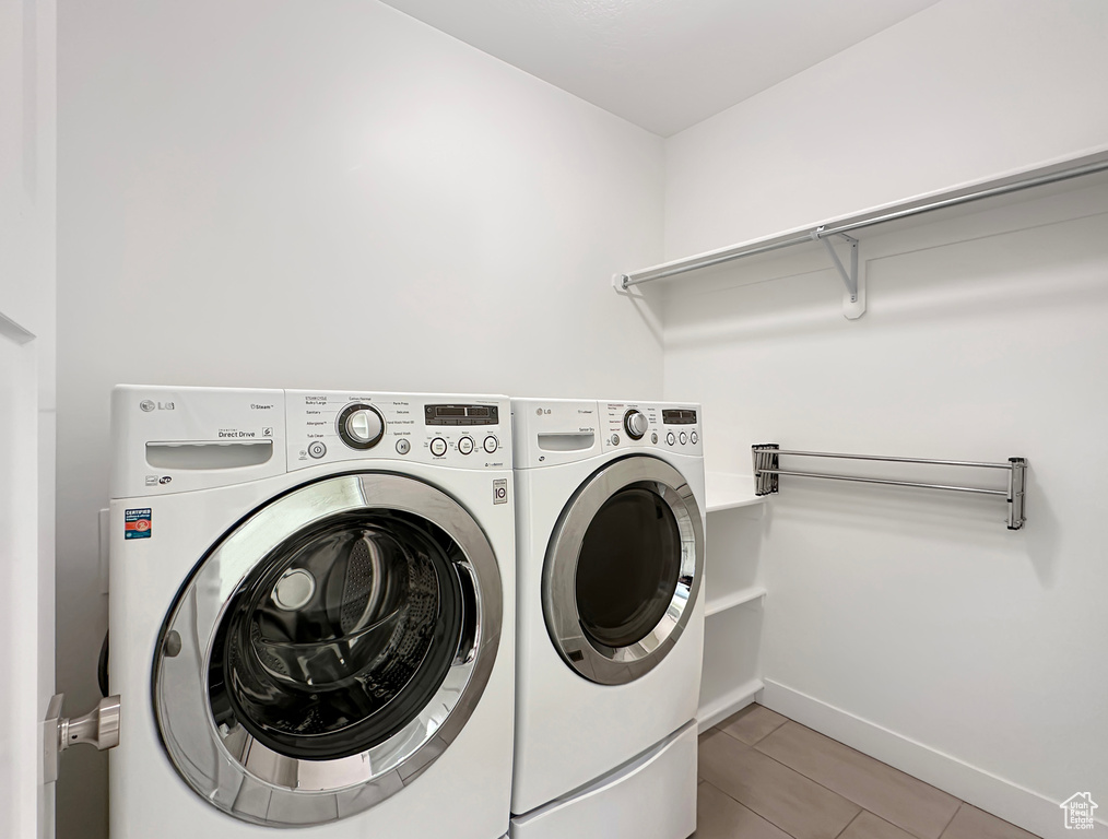 Washroom featuring washing machine and dryer