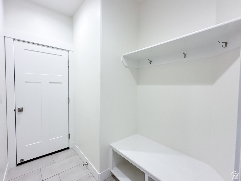 Mudroom featuring light tile patterned floors