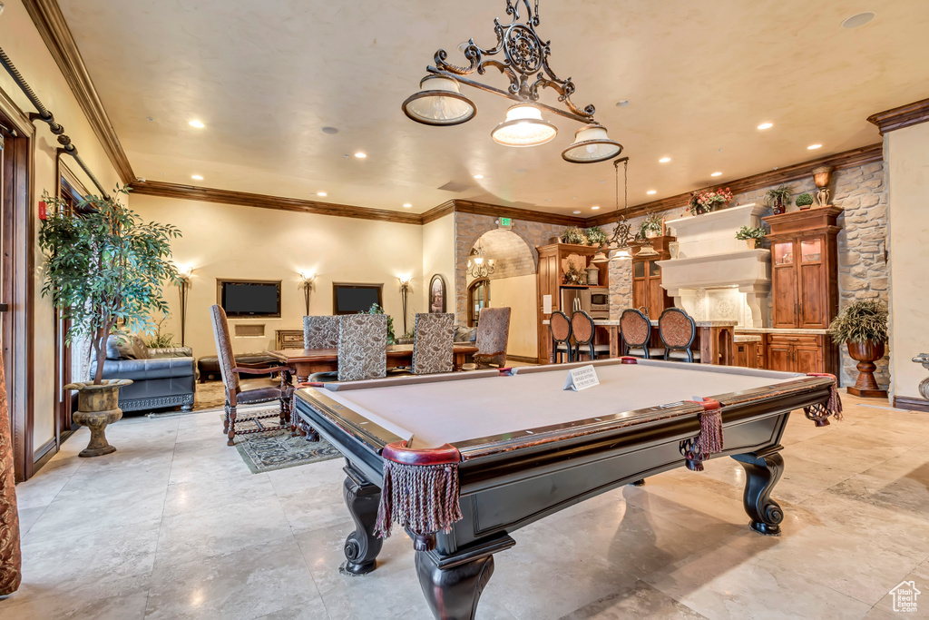 Rec room featuring pool table, crown molding, and light tile patterned floors