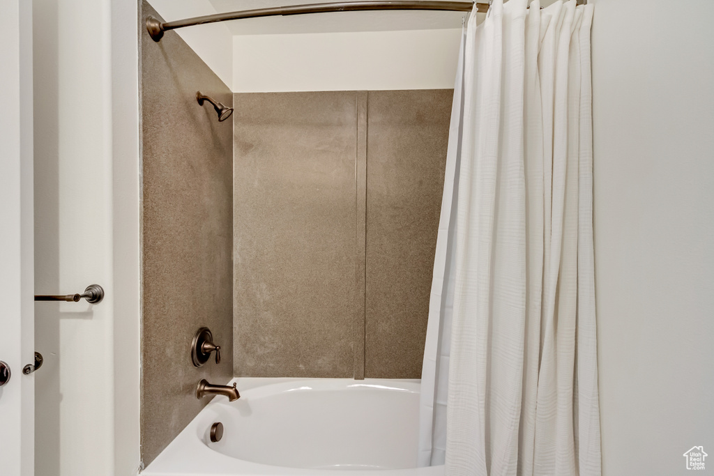 Bathroom with shower / bath combo with shower curtain