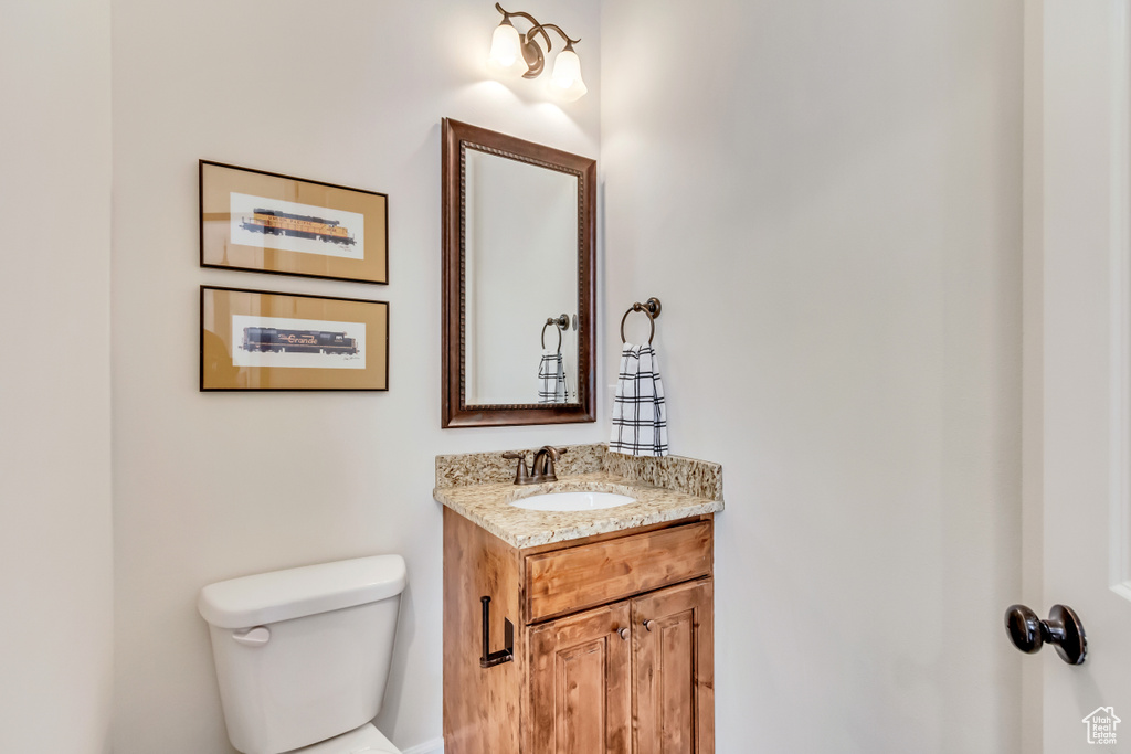 Bathroom featuring vanity and toilet