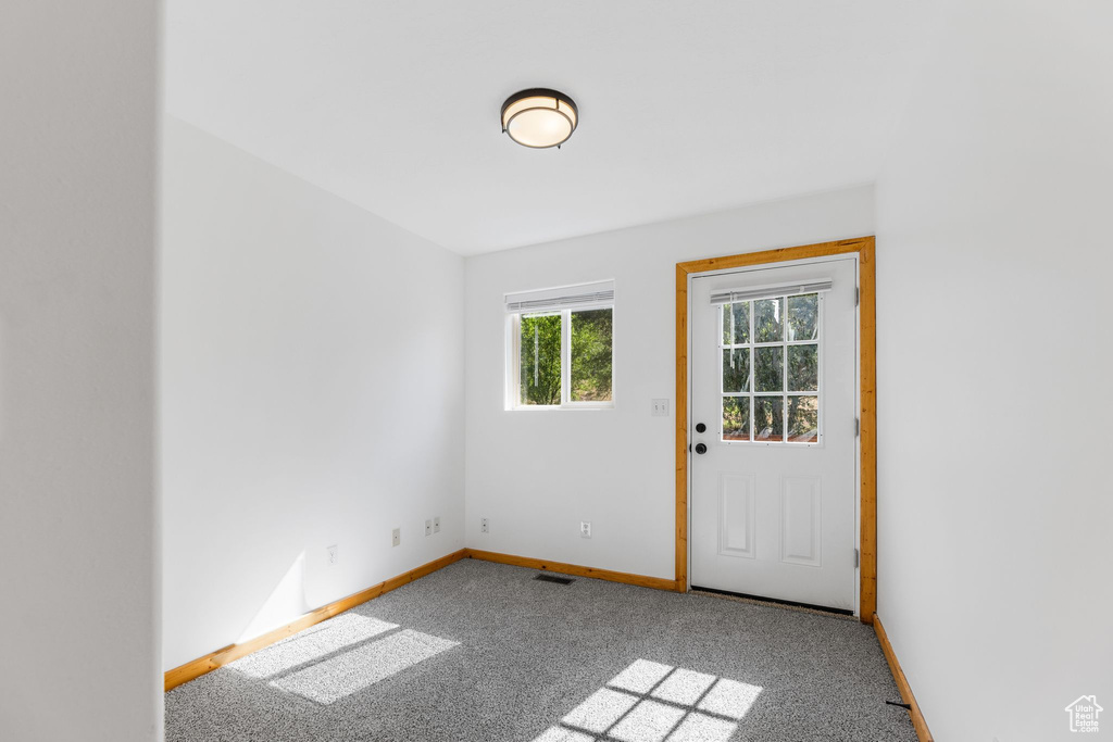 Unfurnished room featuring carpet flooring