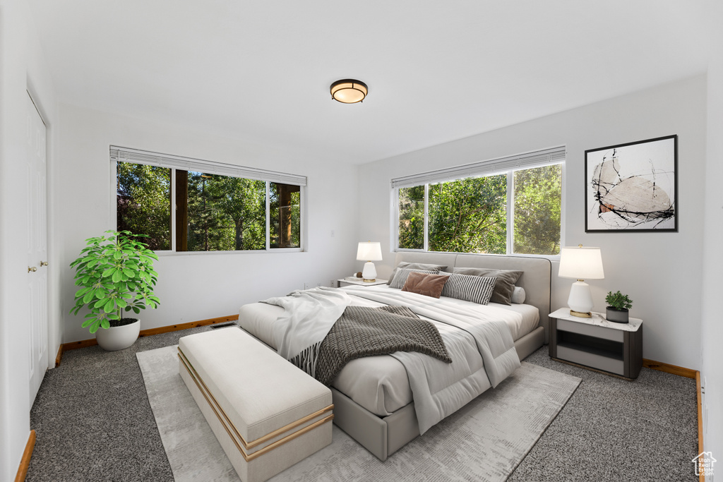 Bedroom featuring light colored carpet